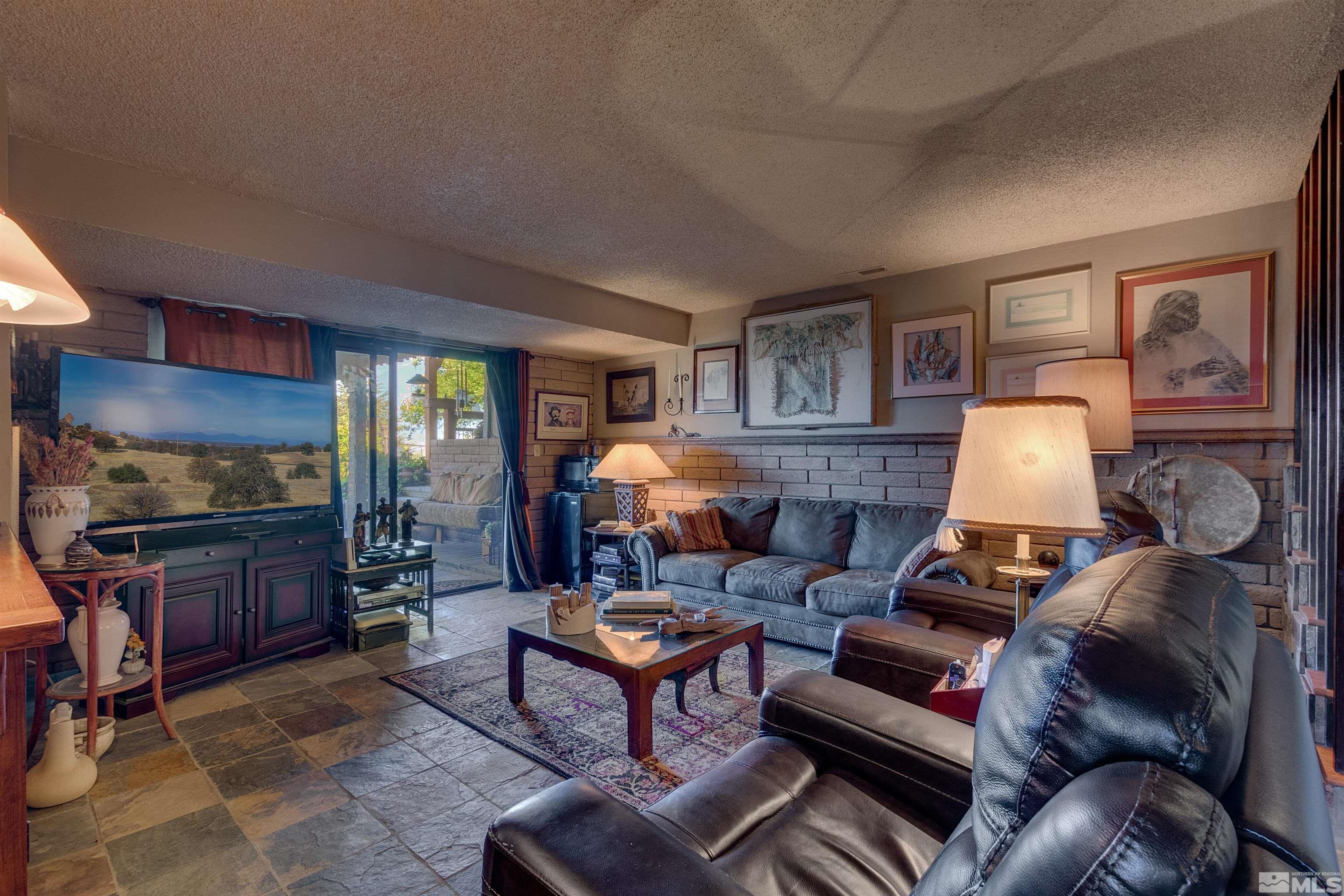 2087 Chanslor Circle Reno, NV 89509 - Photo 28 of 29 a living room with furniture a lamp and a window