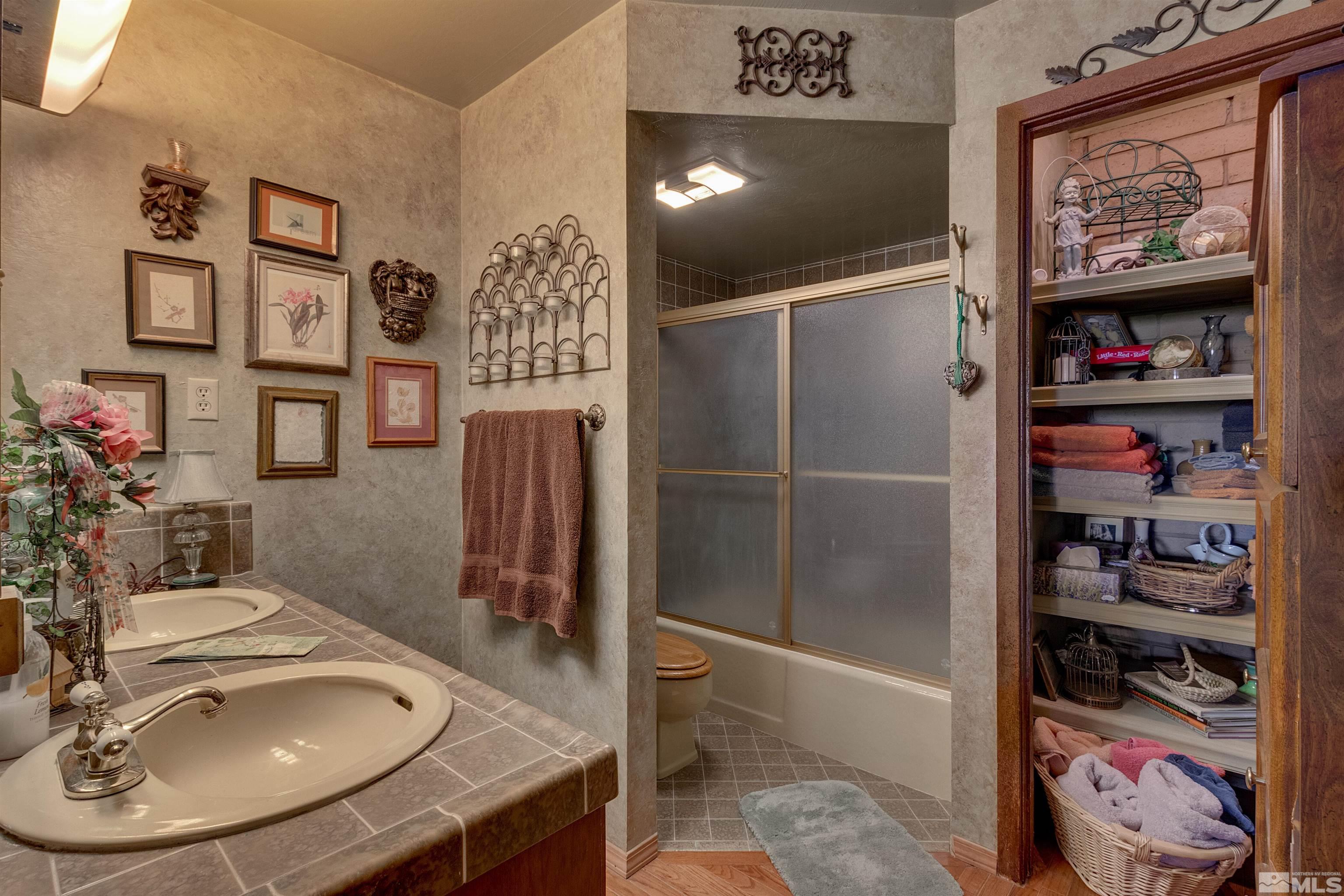 2087 Chanslor Circle Reno, NV 89509 - Photo 29 of 29 a bathroom with a sink and a mirror