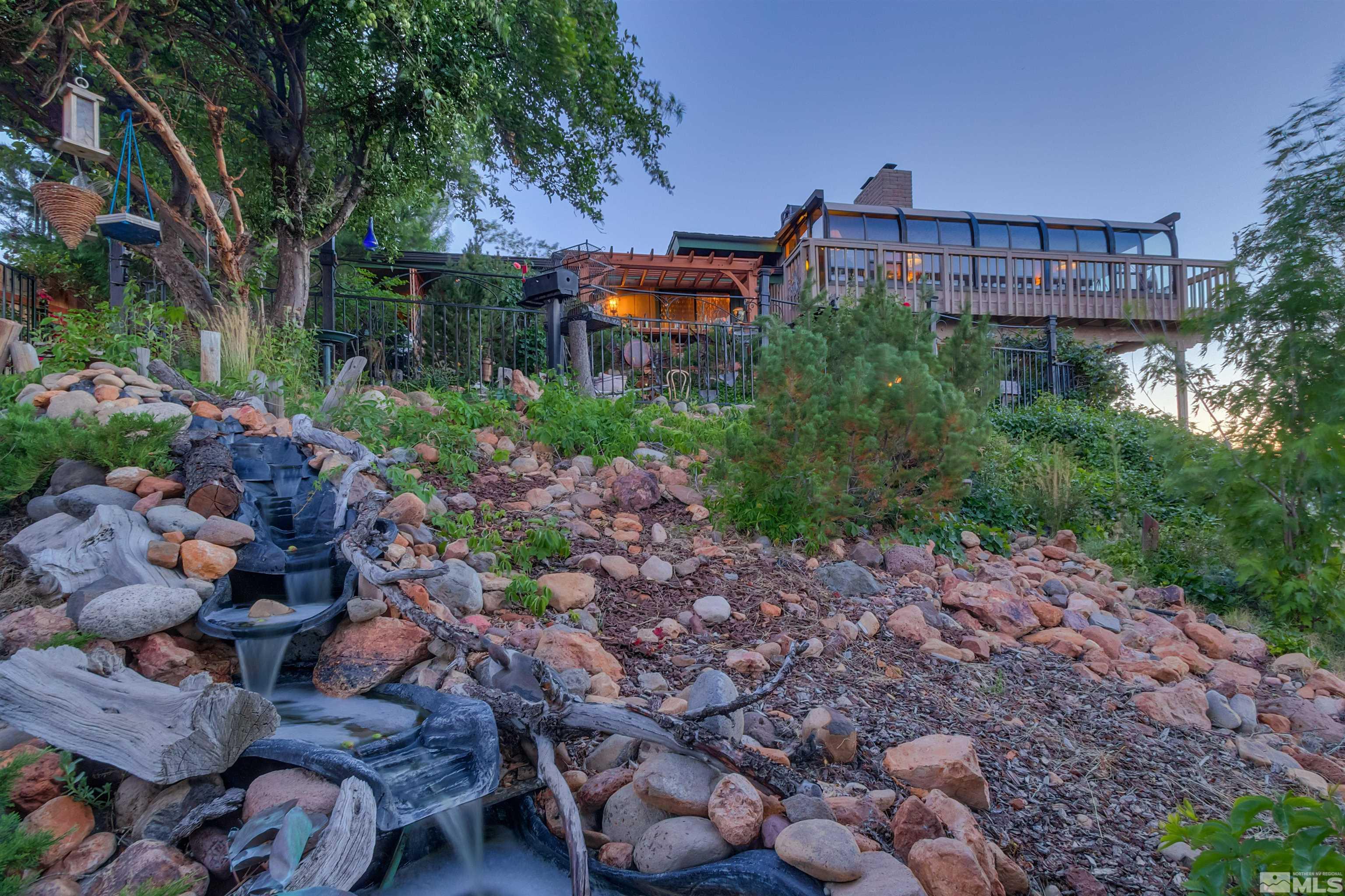 2087 Chanslor Circle Reno, NV 89509 - Photo 3 of 29 a backyard of a house with lots of plants and trees