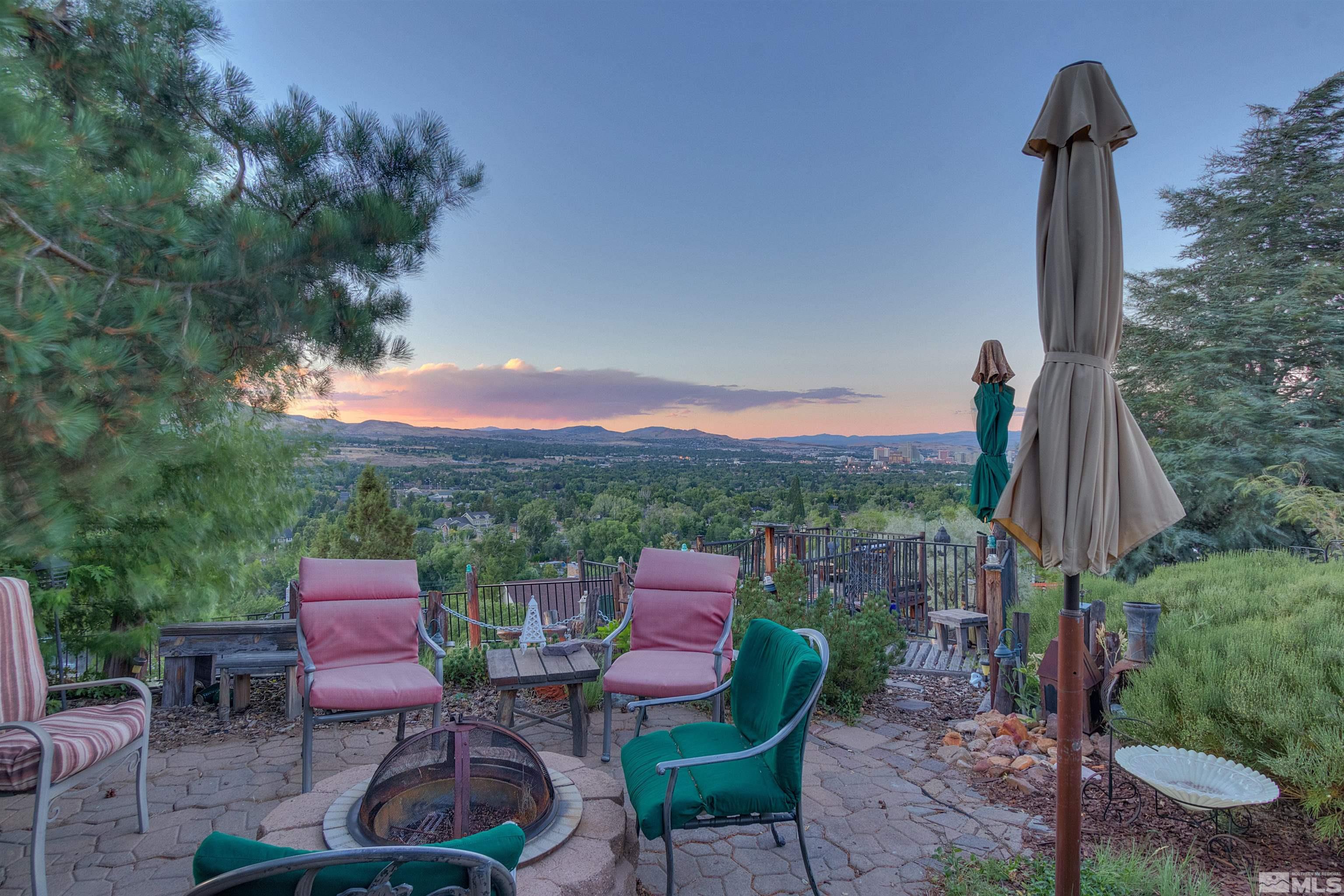 2087 Chanslor Circle Reno, NV 89509 - Photo 6 of 29 a view of a patio with couches table and chairs with wooden fence and plants