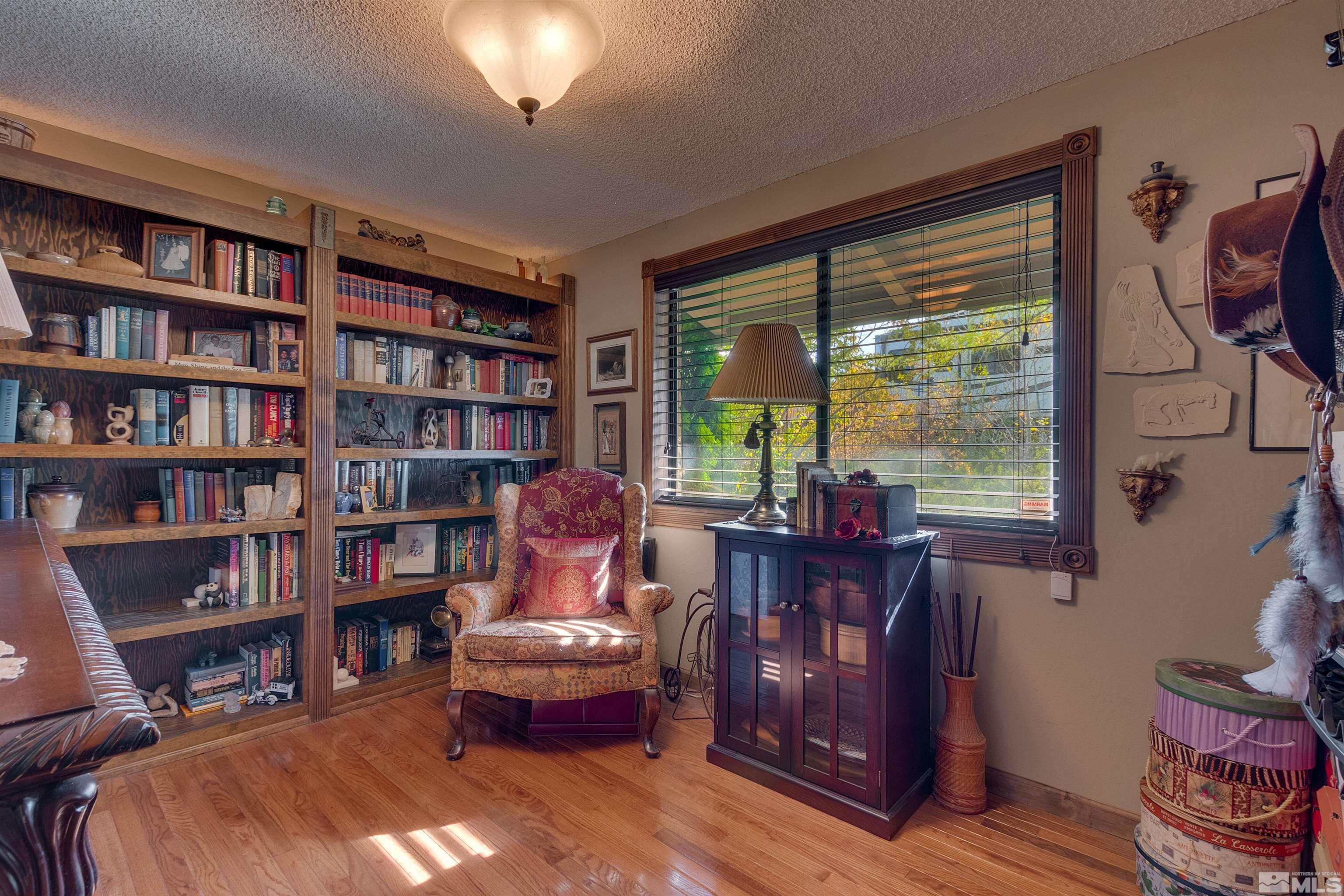 2087 Chanslor Circle Reno, NV 89509 - Photo 9 of 29 a living room with furniture and a book shelf