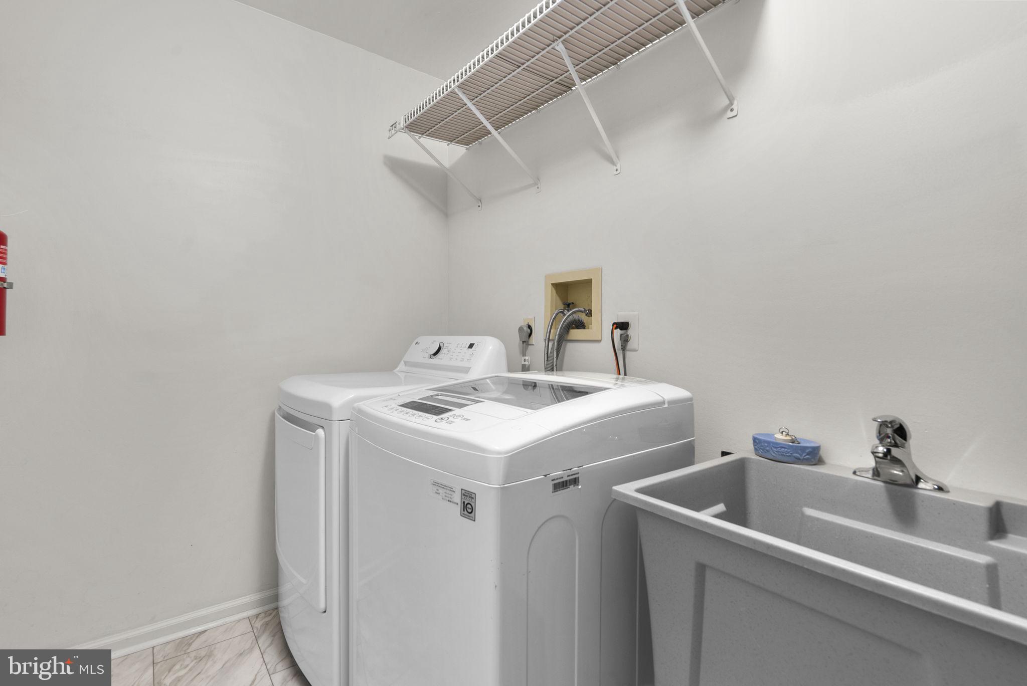 8201 Sandy Stream Road Laurel, MD 20723 - Photo 22 of 51 1st floor mudroom w/replaced W/D and utility sink