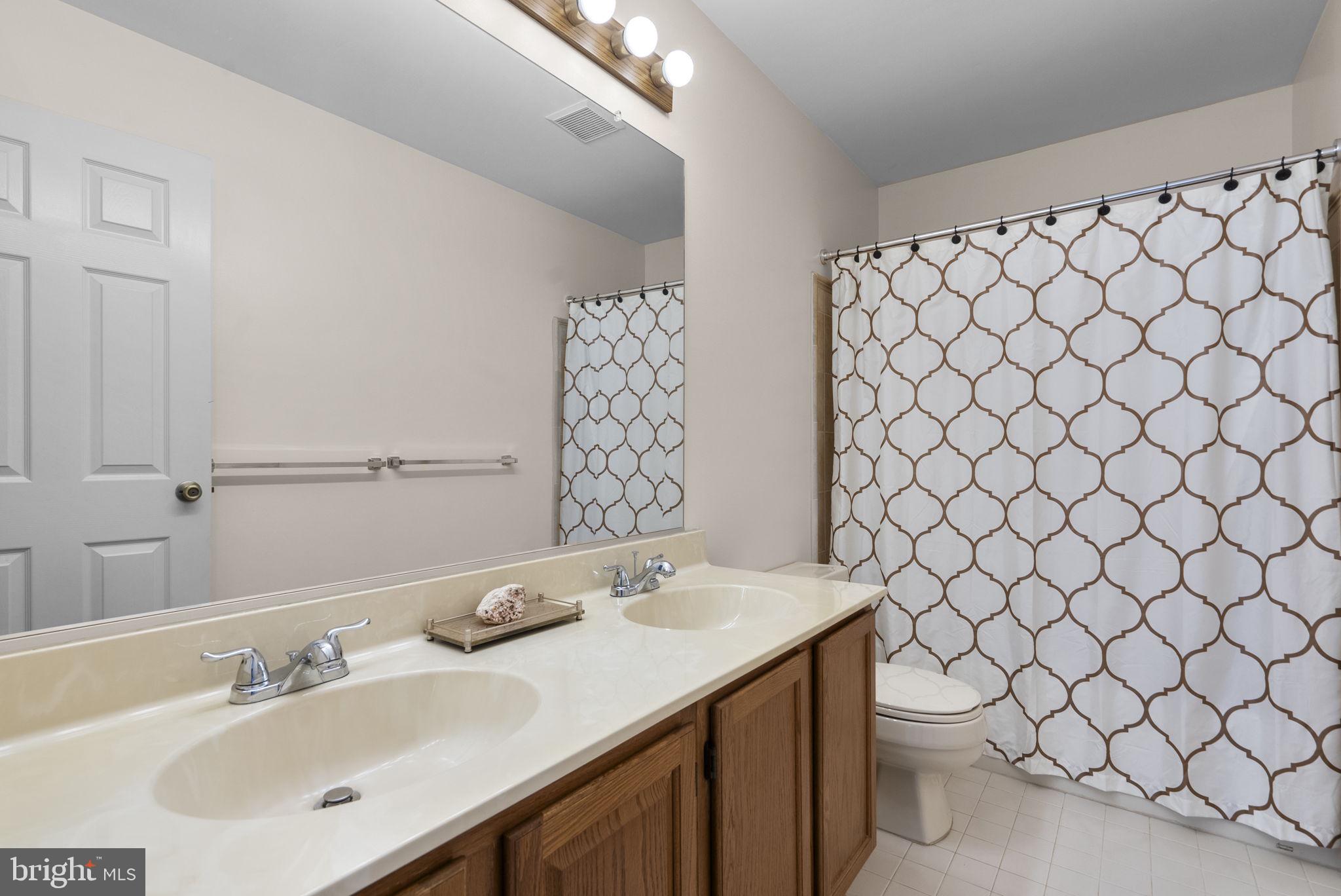 8201 Sandy Stream Road Laurel, MD 20723 - Photo 36 of 51 2nd full bathroom w/double sinks