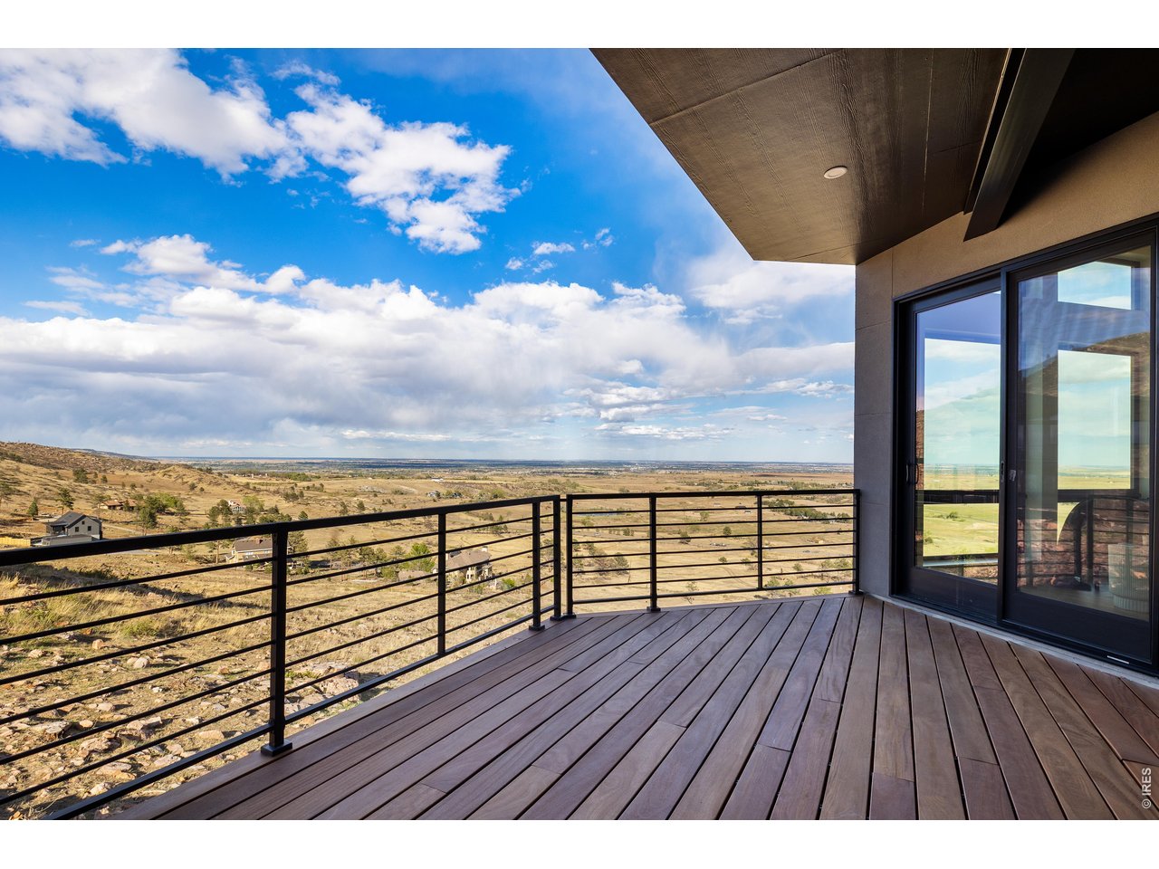 9578 Mountain Ridge Drive Boulder, CO 80302 - Photo 22 of 47 a view of a balcony with wooden floor