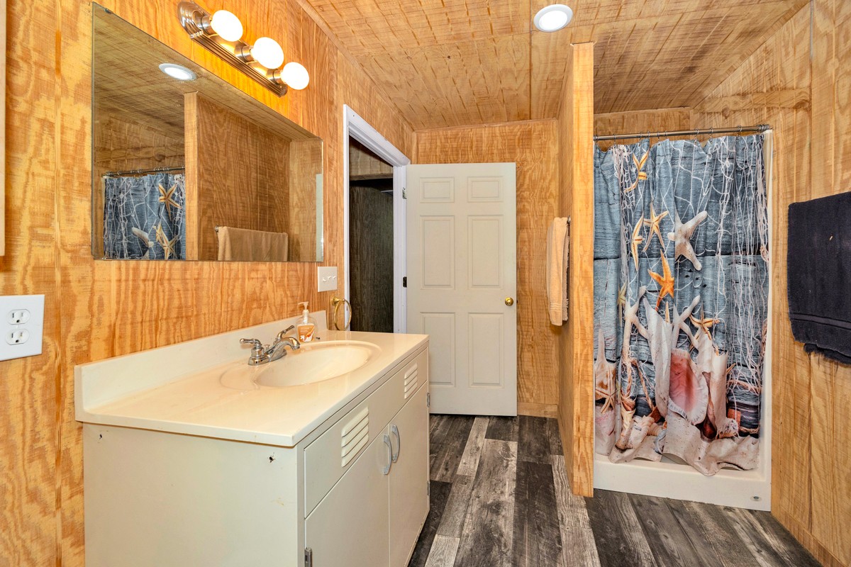 167 Henry Bayless Road Ardmore, TN 38449 - Photo 12 of 30 a bathroom with a sink and a mirror