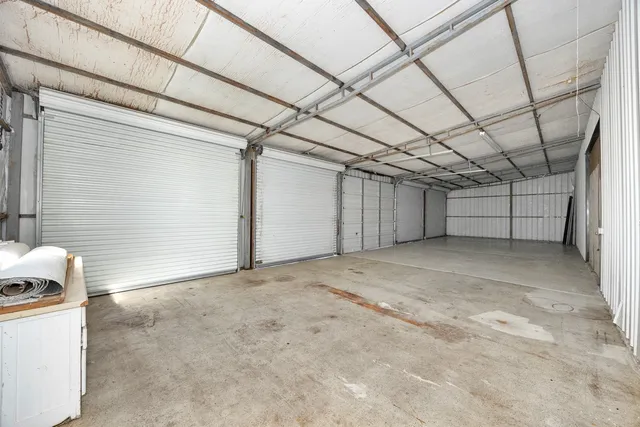 a view of a hallway with wooden furniture