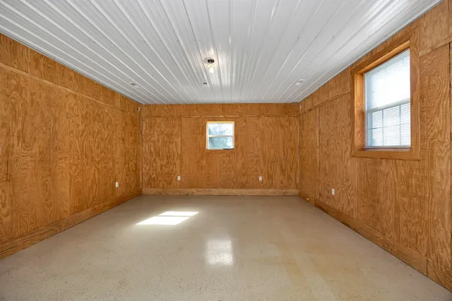 a view of empty room with windows