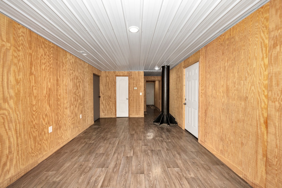 167 Henry Bayless Road Ardmore, TN 38449 - Photo 7 of 30 a view of a room with wooden floor and gate