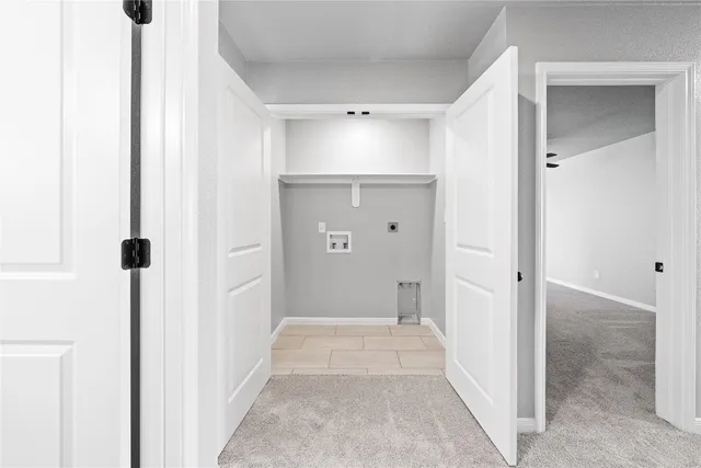 a view of a hallway with wooden shelves