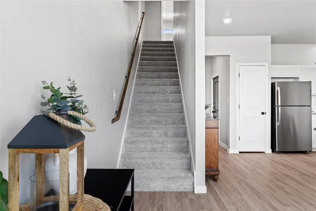 a view of entryway with wooden floor and stairs