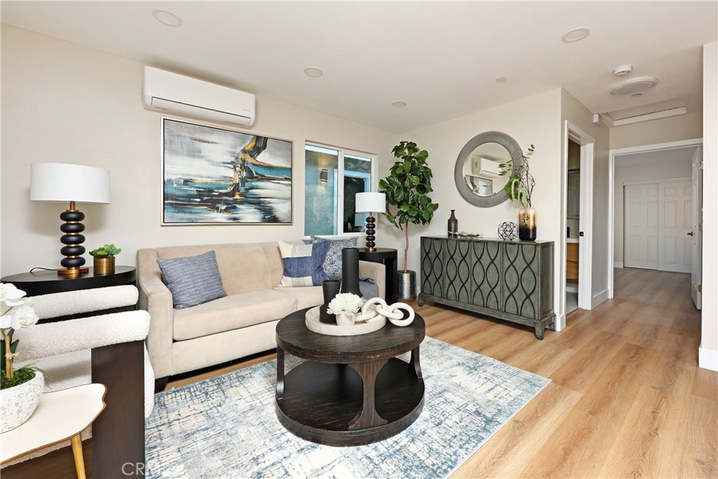 5571 Central Avenue Riverside, CA 92504 - Photo 14 of 21 a living room with furniture a clock and a rug