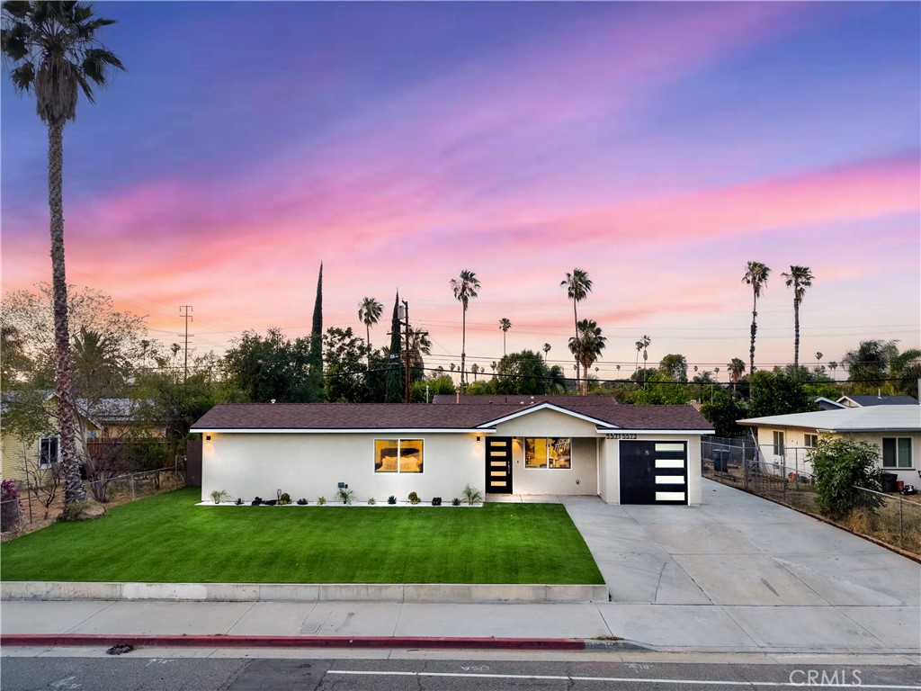5571 Central Avenue Riverside, CA 92504 - Photo 18 of 21 a front view of a house with a yard and garage