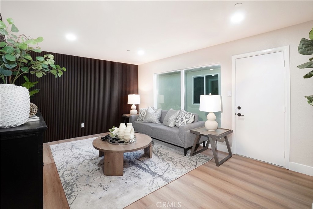5571 Central Avenue Riverside, CA 92504 - Photo 3 of 21 a living room with furniture and a potted plant