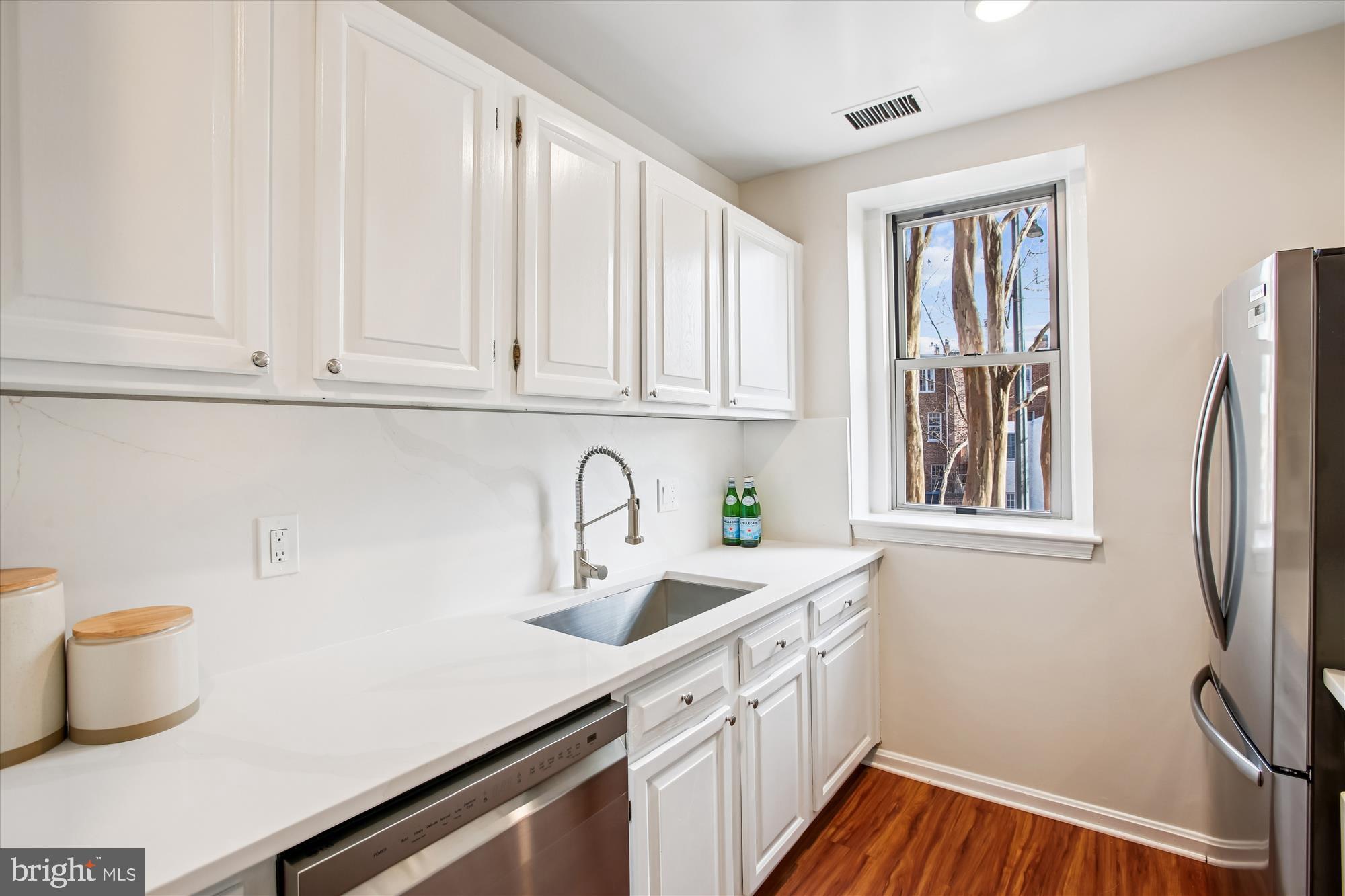 2129 Florida Avenue Northwest, Unit 101 Washington, DC 20008 - Photo 7 of 40 Bright and airy kitchen with modern finishes.