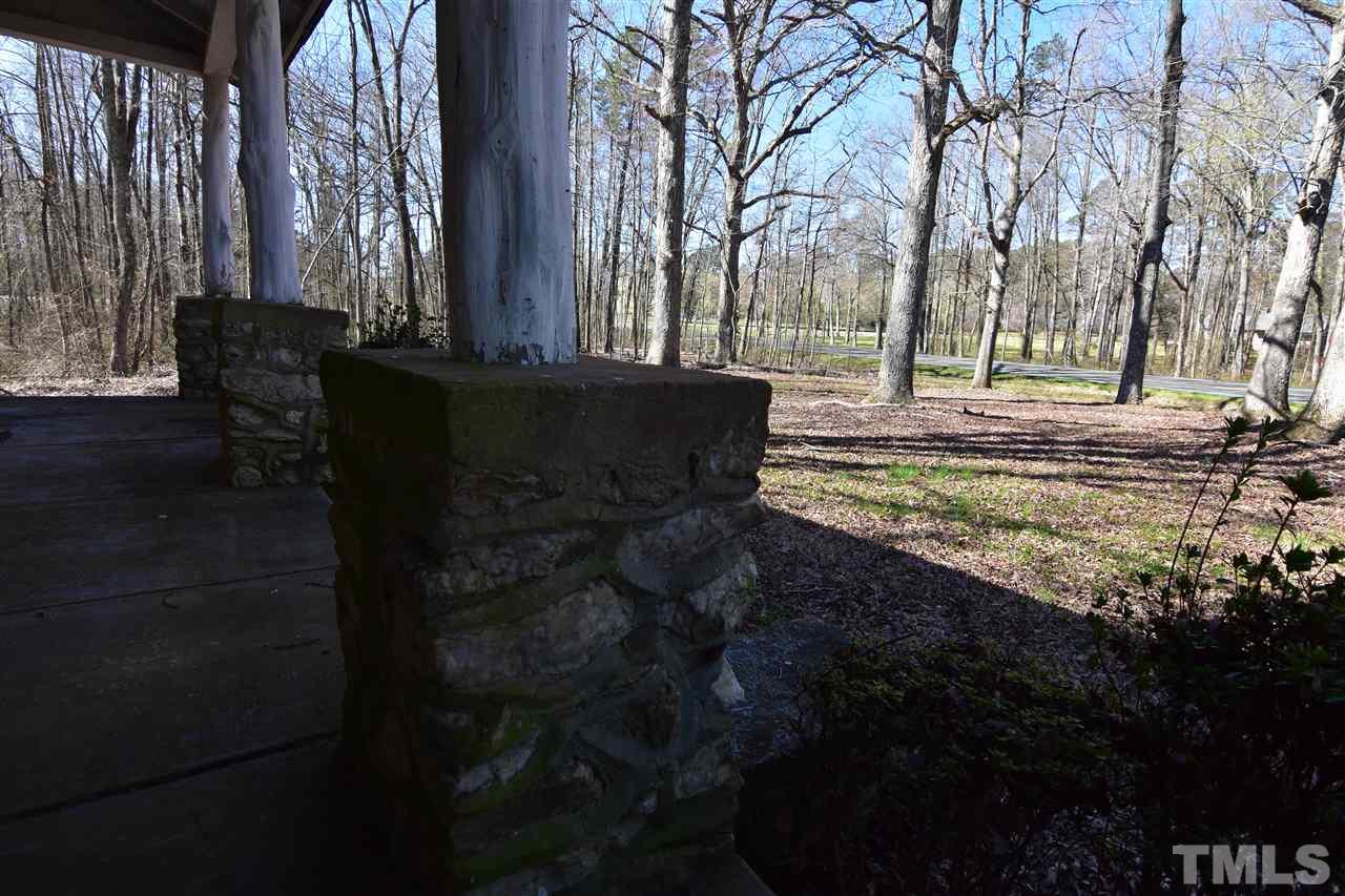 5175 Hurdle Mills Road Roxboro, NC 27574 - Photo 8 of 10 a view of a yard with plants