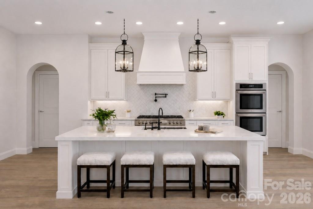 9745 Flowes Store Road Midland, NC 28107 - Photo 9 of 20 a kitchen with stainless steel appliances kitchen island granite countertop a table chairs and a refrigerator