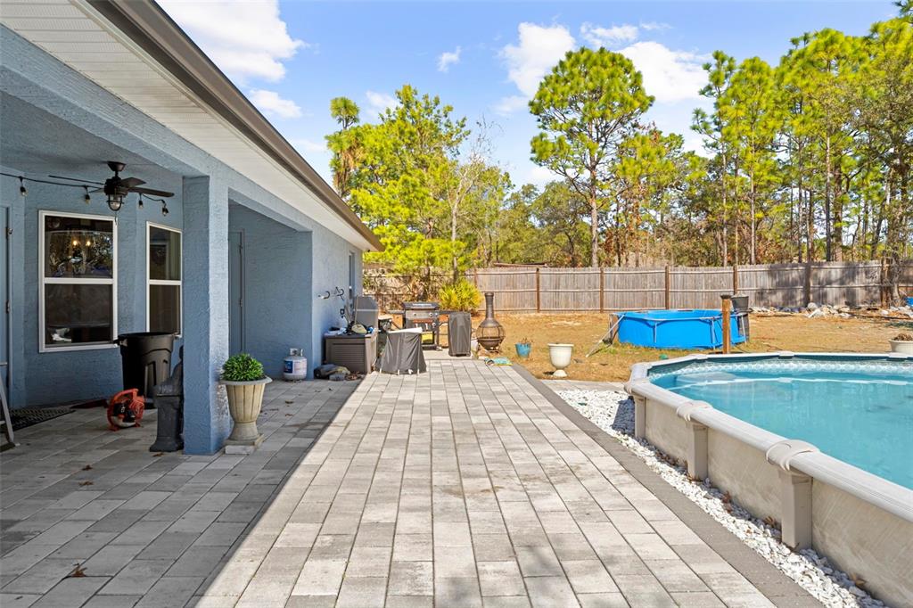 12034 Mandlin Road Weeki Wachee, FL 34614 - Photo 11 of 51 a view of a backyard with swimming pool