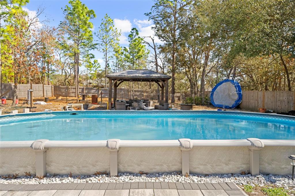 12034 Mandlin Road Weeki Wachee, FL 34614 - Photo 12 of 51 front view of a house with a yard