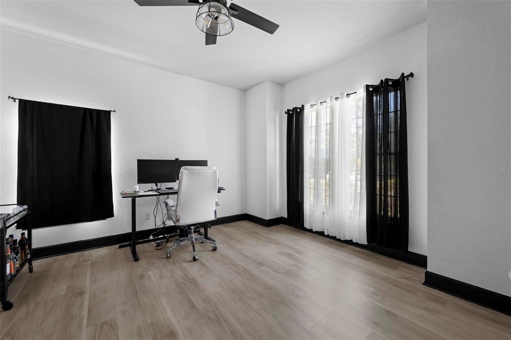 12034 Mandlin Road Weeki Wachee, FL 34614 - Photo 15 of 51 a view of a livingroom with a flat screen tv