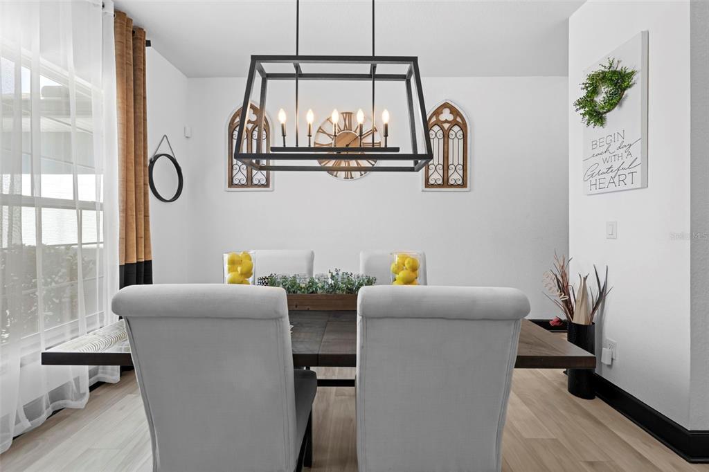 12034 Mandlin Road Weeki Wachee, FL 34614 - Photo 18 of 51 a dining room with furniture and a window