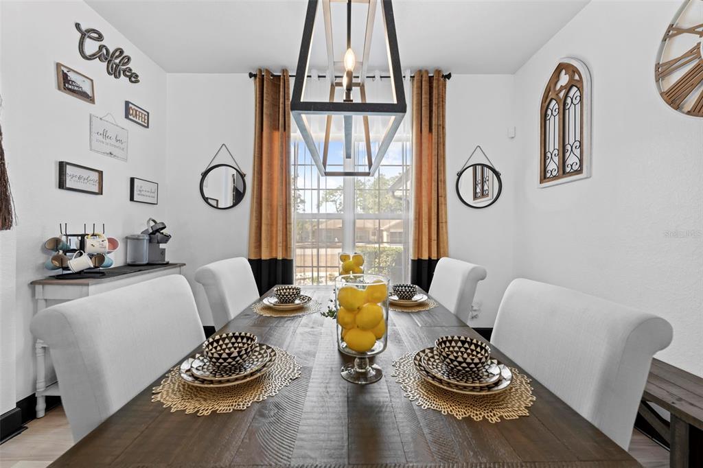 12034 Mandlin Road Weeki Wachee, FL 34614 - Photo 19 of 51 a living room with furniture and a table