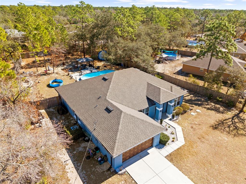 12034 Mandlin Road Weeki Wachee, FL 34614 - Photo 2 of 51 an aerial view of a house with a yard