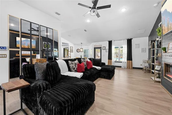 a living room with furniture and a fireplace