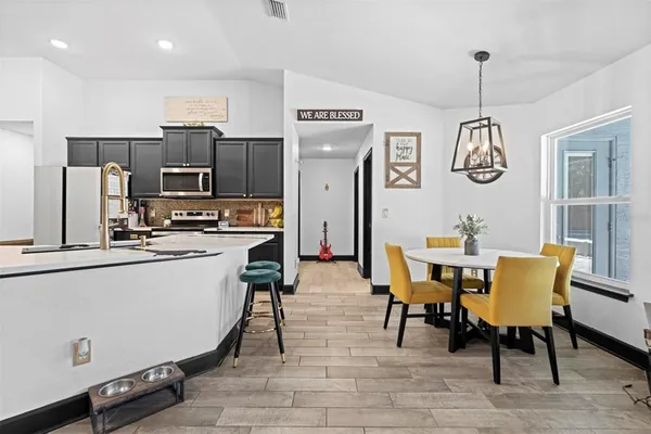 a view of a dining room with furniture window and wooden floor