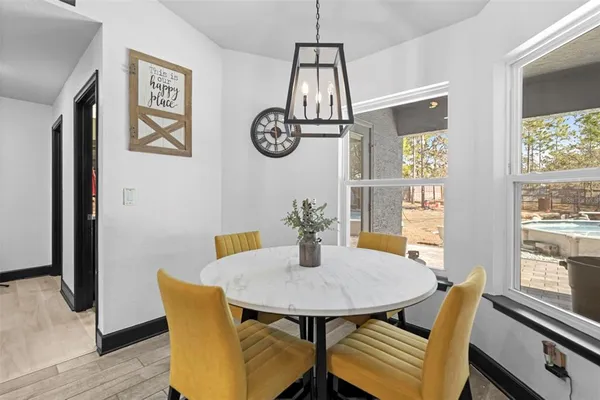 a view of a dining room with furniture