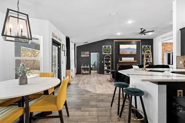 a kitchen with stainless steel appliances a stove refrigerator sink and stove