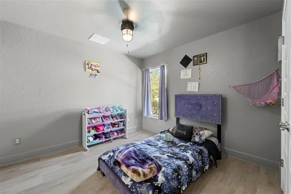 a view of a livingroom with furniture window and wooden floor