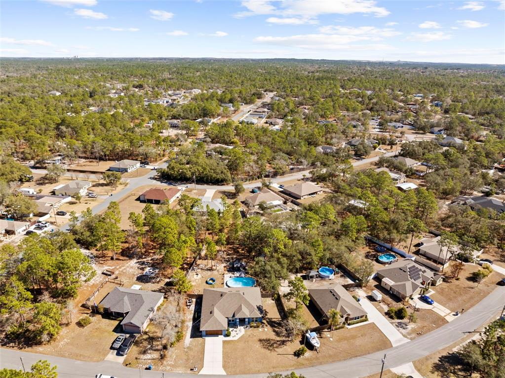 12034 Mandlin Road Weeki Wachee, FL 34614 - Photo 6 of 51 an aerial view of residential building with parking space