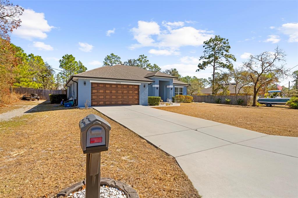12034 Mandlin Road Weeki Wachee, FL 34614 - Photo 9 of 51 a front view of a house with yard