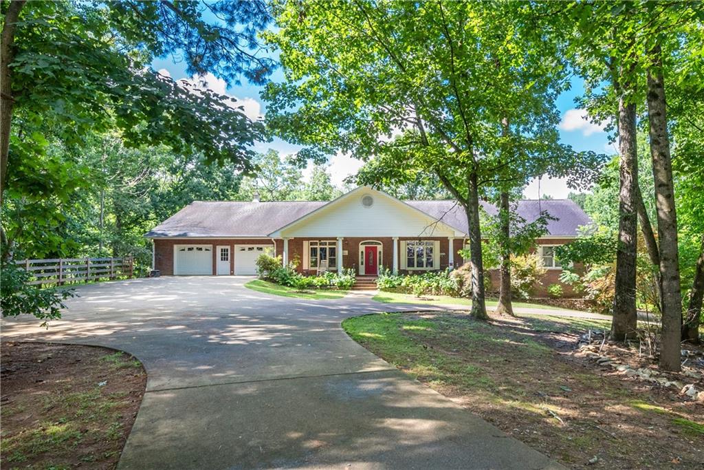 755 Harris Road Jasper, GA 30143 - Photo 13 of 60 a front view of a house with a garden