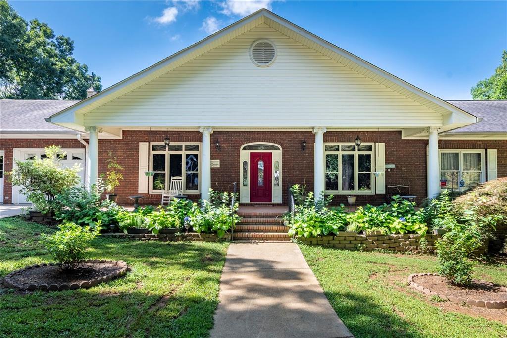 755 Harris Road Jasper, GA 30143 - Photo 14 of 60 a front view of a house with garden