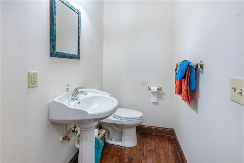 755 Harris Road Jasper, GA 30143 - Photo 21 of 60 a bathroom with a toilet sink and mirror