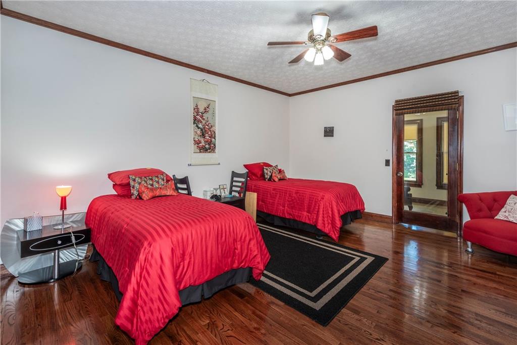 755 Harris Road Jasper, GA 30143 - Photo 31 of 60 a bedroom with bed and a chandelier