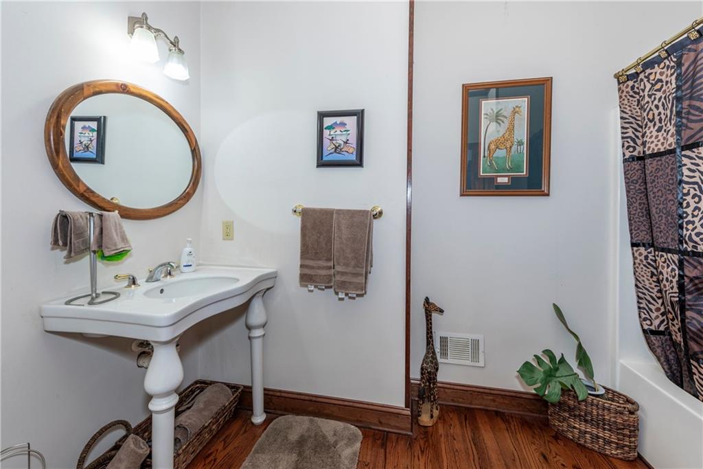 755 Harris Road Jasper, GA 30143 - Photo 32 of 60 a bathroom with a sink and a mirror