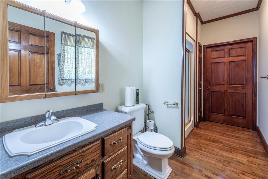 755 Harris Road Jasper, GA 30143 - Photo 35 of 60 a bathroom with a sink a toilet and shower
