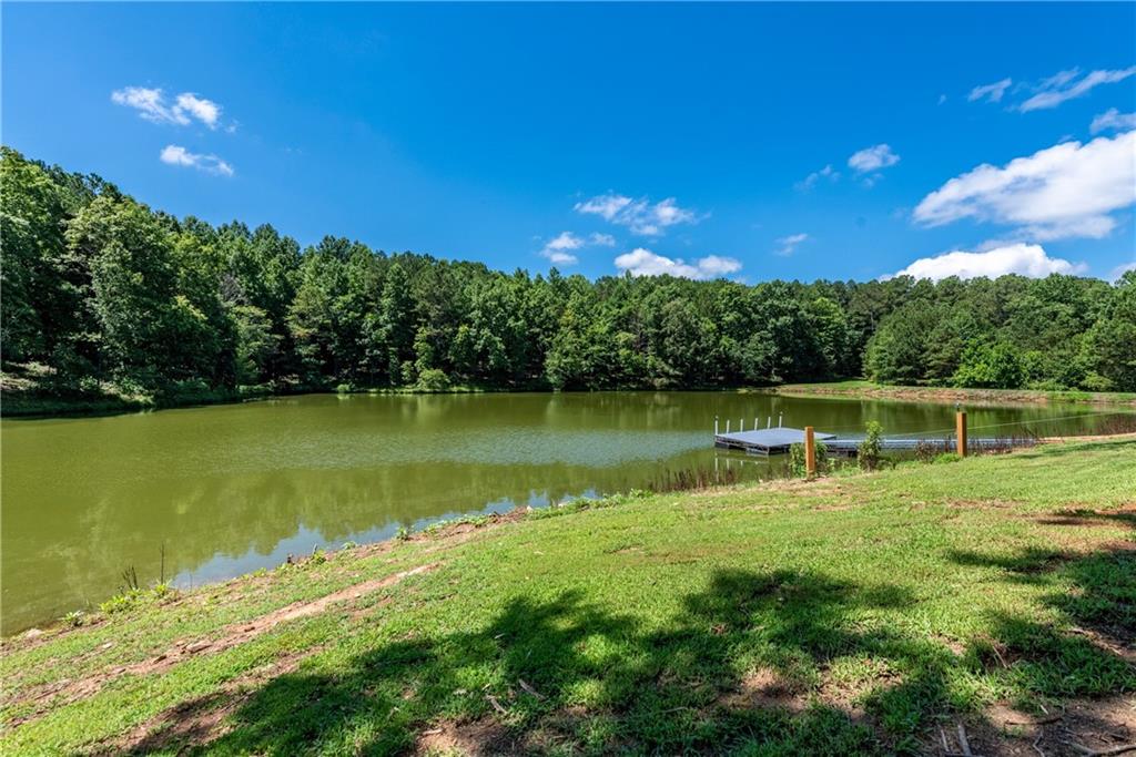 755 Harris Road Jasper, GA 30143 - Photo 46 of 60 a view of a lake with a big yard