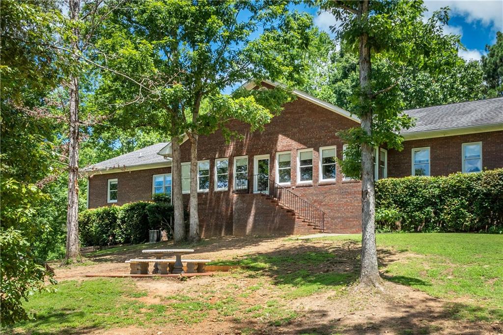 755 Harris Road Jasper, GA 30143 - Photo 52 of 60 a front view of house with yard and green space