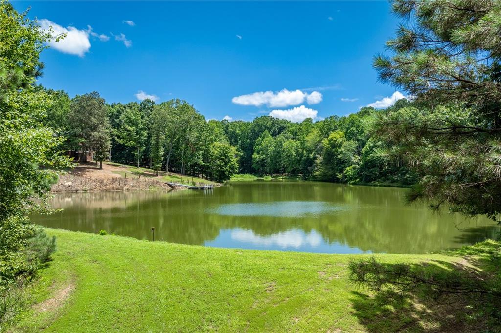 755 Harris Road Jasper, GA 30143 - Photo 53 of 60 a view of a lake in between two of trees