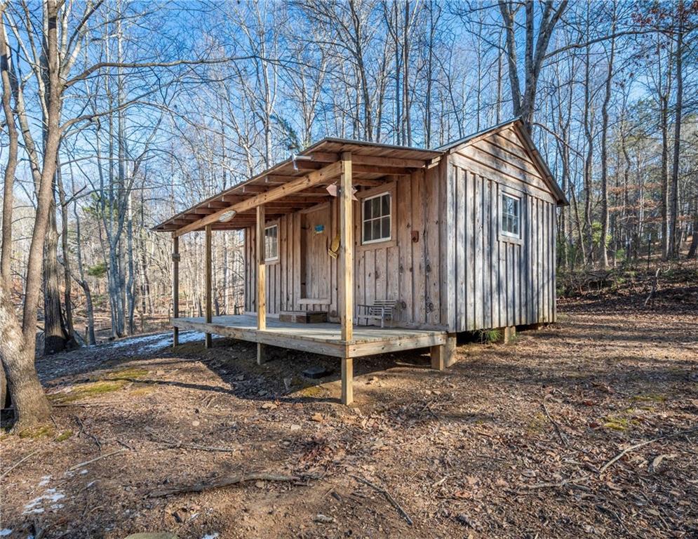 755 Harris Road Jasper, GA 30143 - Photo 59 of 60 a backyard of a house with bicycles parked and trees