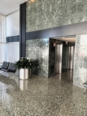 a view of an empty room with a large window