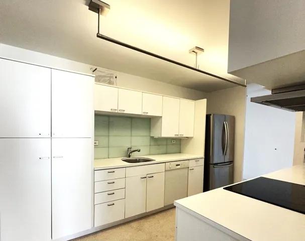 a kitchen with a sink and a microwave