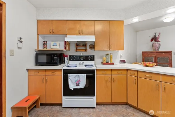 a kitchen with stainless steel appliances a stove and a refrigerator