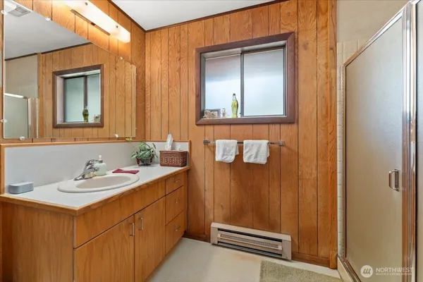 a bathroom with a sink and a mirror
