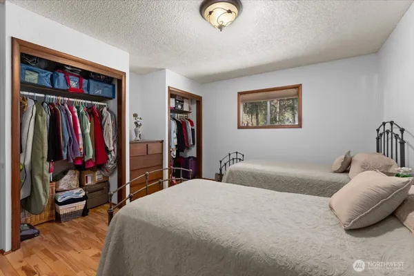 a bedroom with bed and a window