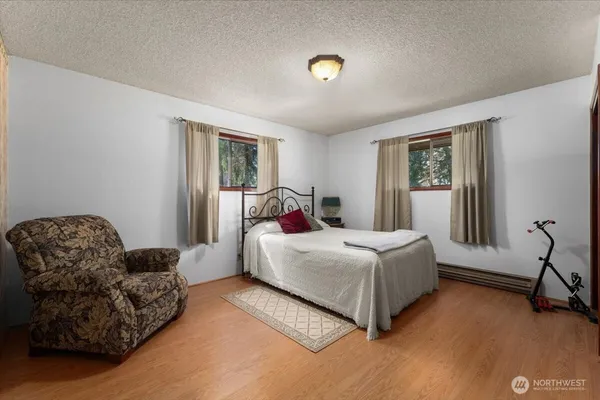 a view of empty room with a fireplace