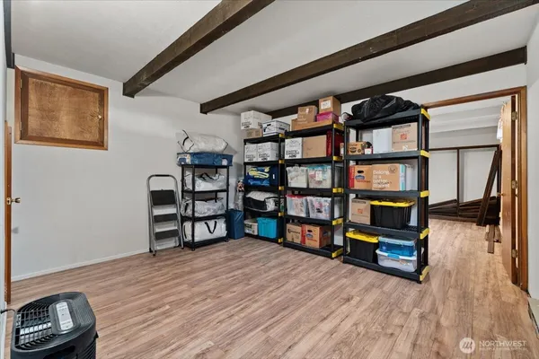 a living room with furniture and a book shelf